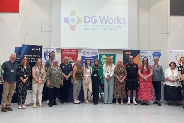 A large group of people pose at the Employability Roadshow 2024